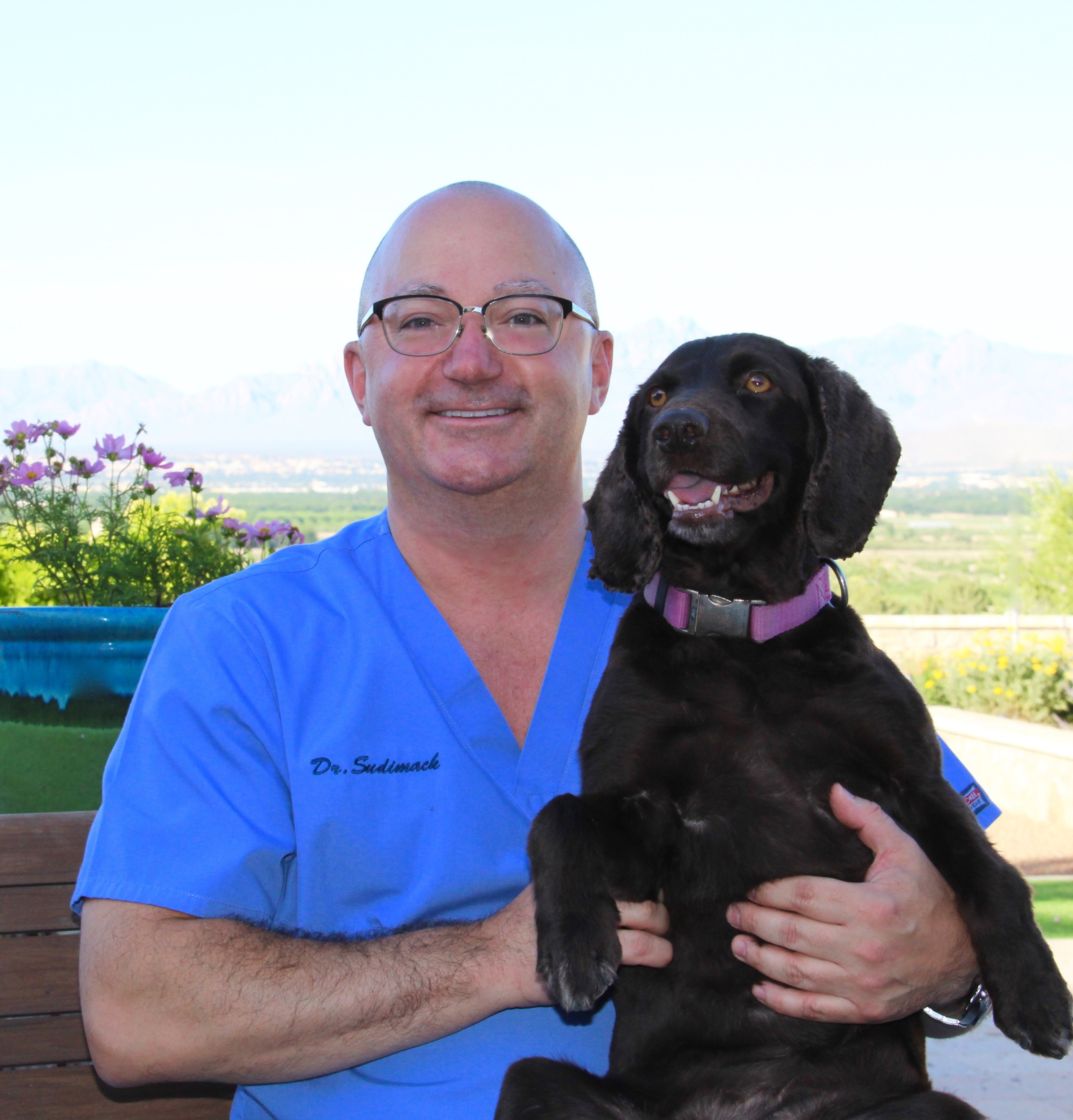 Dr. Dave Sudimack holding Dog